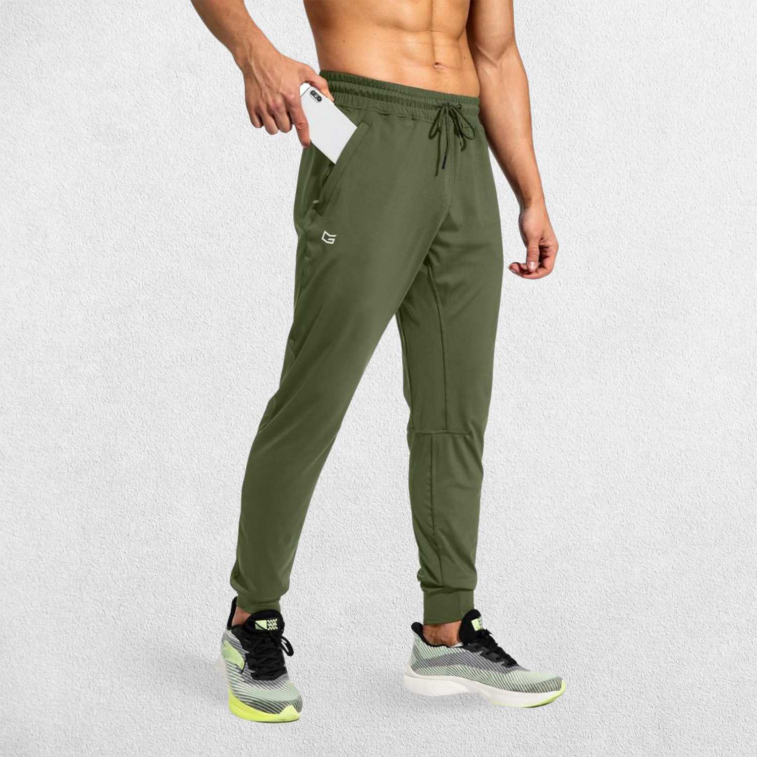 Army Green GPW Men's Athletic Sweatpants featuring zipper pockets, athletic fit, and sleek design.