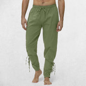 Front Pose Of Model Wearing loose-fit Viking Navigator Pants with lace-up calf design.