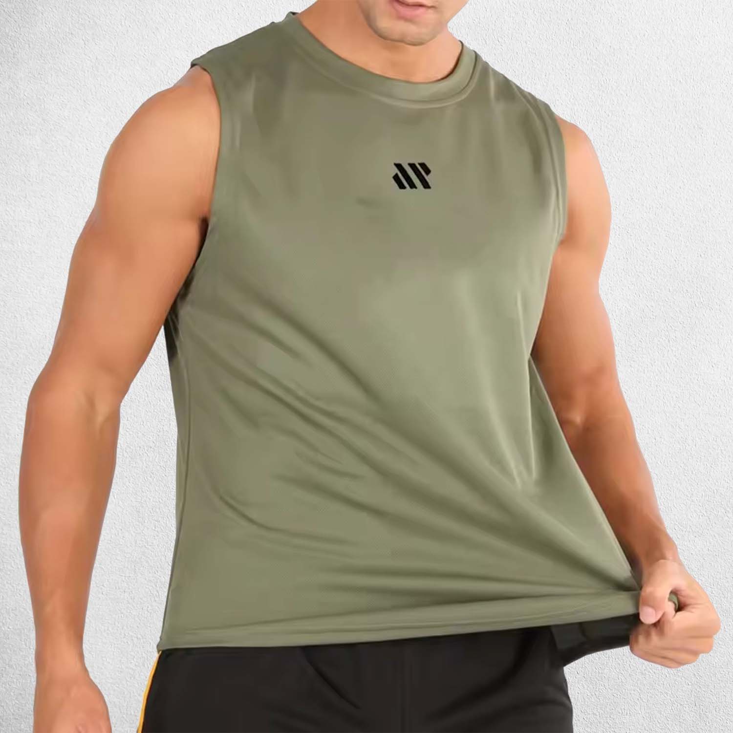 Model demonstrating shoulder mobility in Army Green sleeveless gym tank
