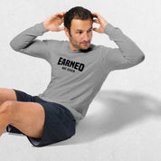 Model Wearing Athletic Heather GPW Unisex Athletic Long Sleeve Tee - Earned Not Given in a studio background