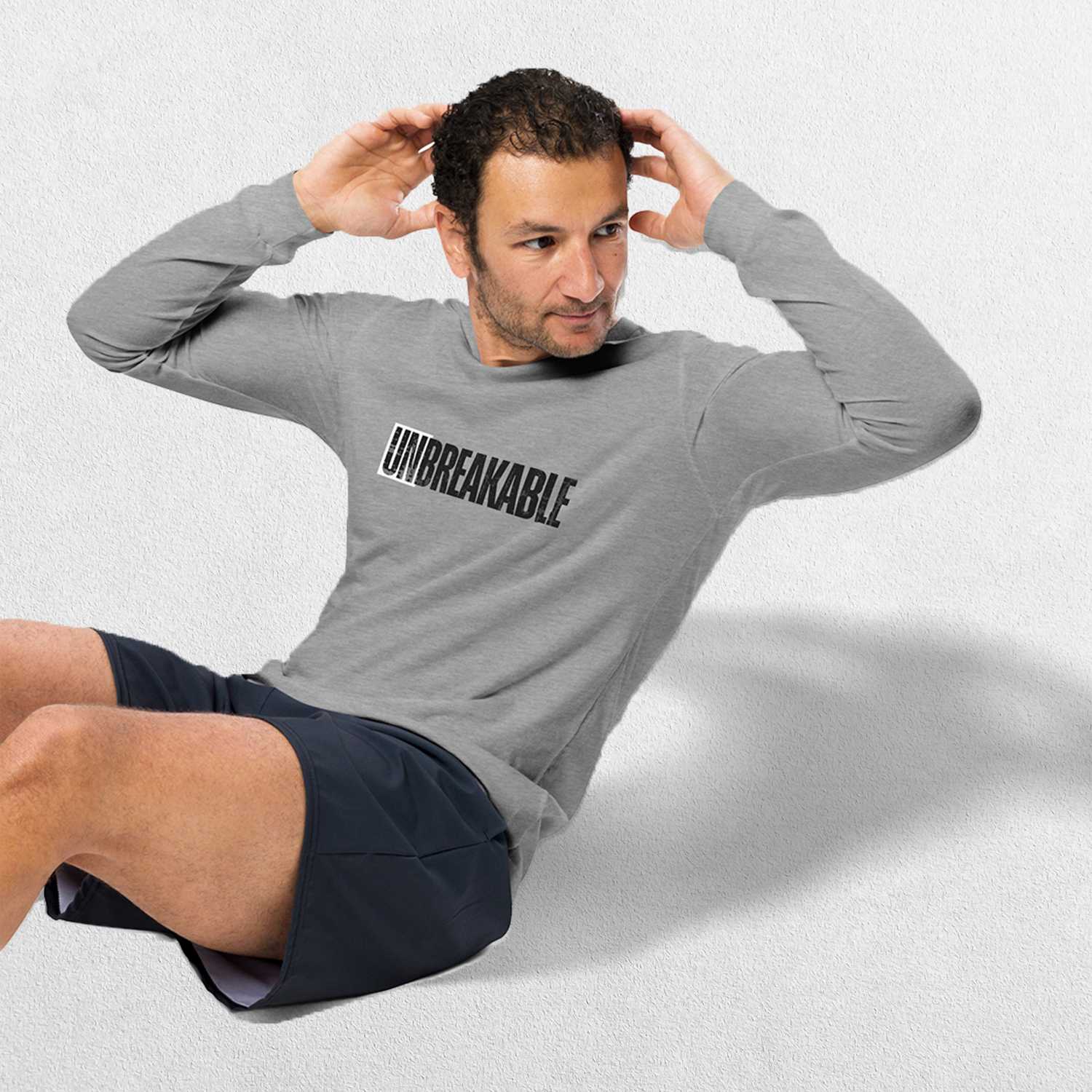 Model wearing the Athletic Heather Unbreakable Printed Unisex Long Sleeve Tee – Durable and Versatile Style