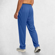 Back View of Model Wearing BLue GPW Men’s Open-Bottom Workout Trousers with Lightweight Mesh