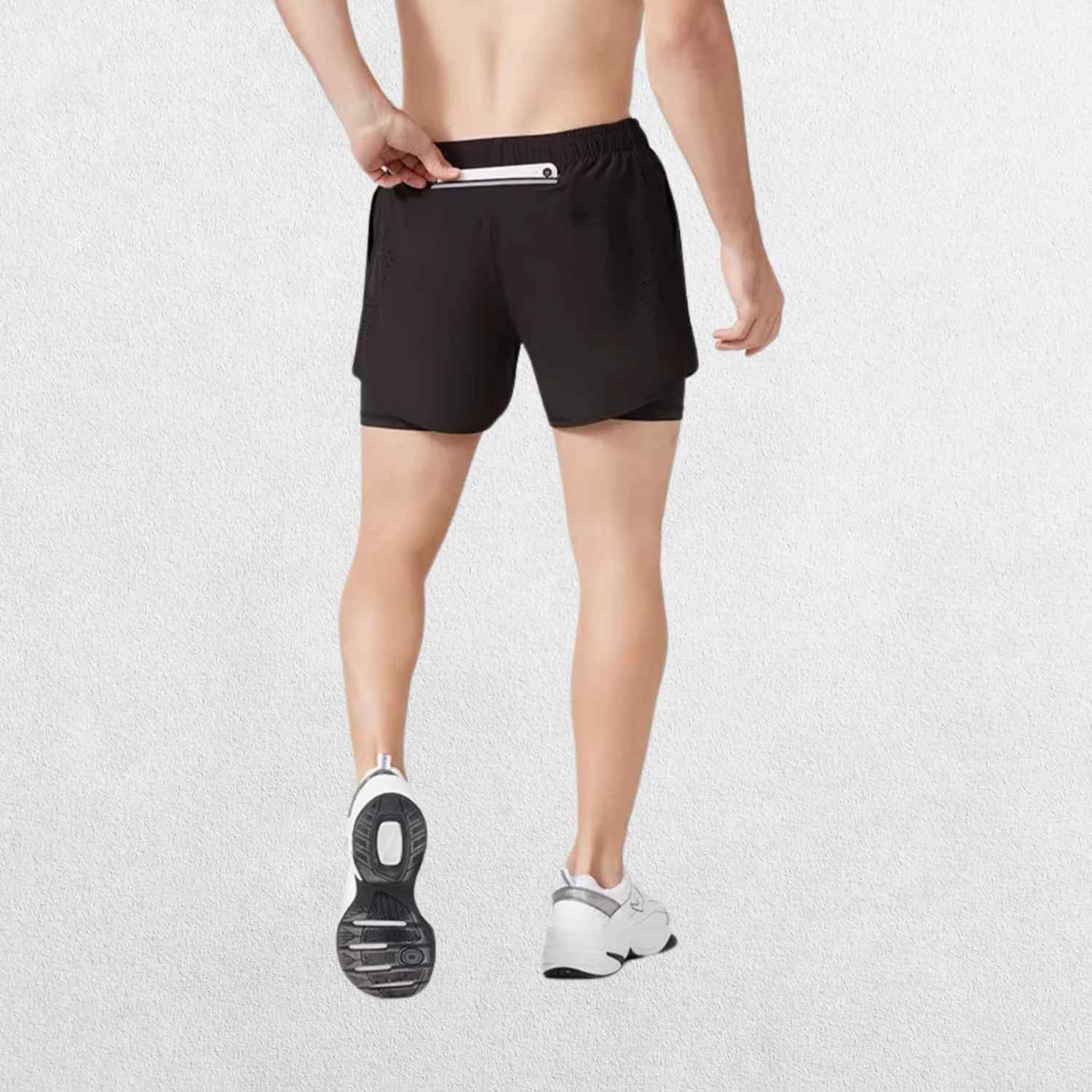 Back view of the GPW High-Performance Men’s Running Shorts in black, featuring a comfortable fit, rear pocket, and moisture-wicking fabric against a plain studio background."
