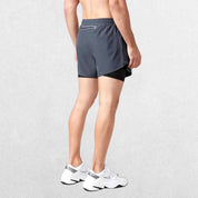 "Back view of the GPW High-Performance Men’s Running Shorts in dark grey, showing the stylish cut, rear pocket, and durable stitching against a professional studio setting."