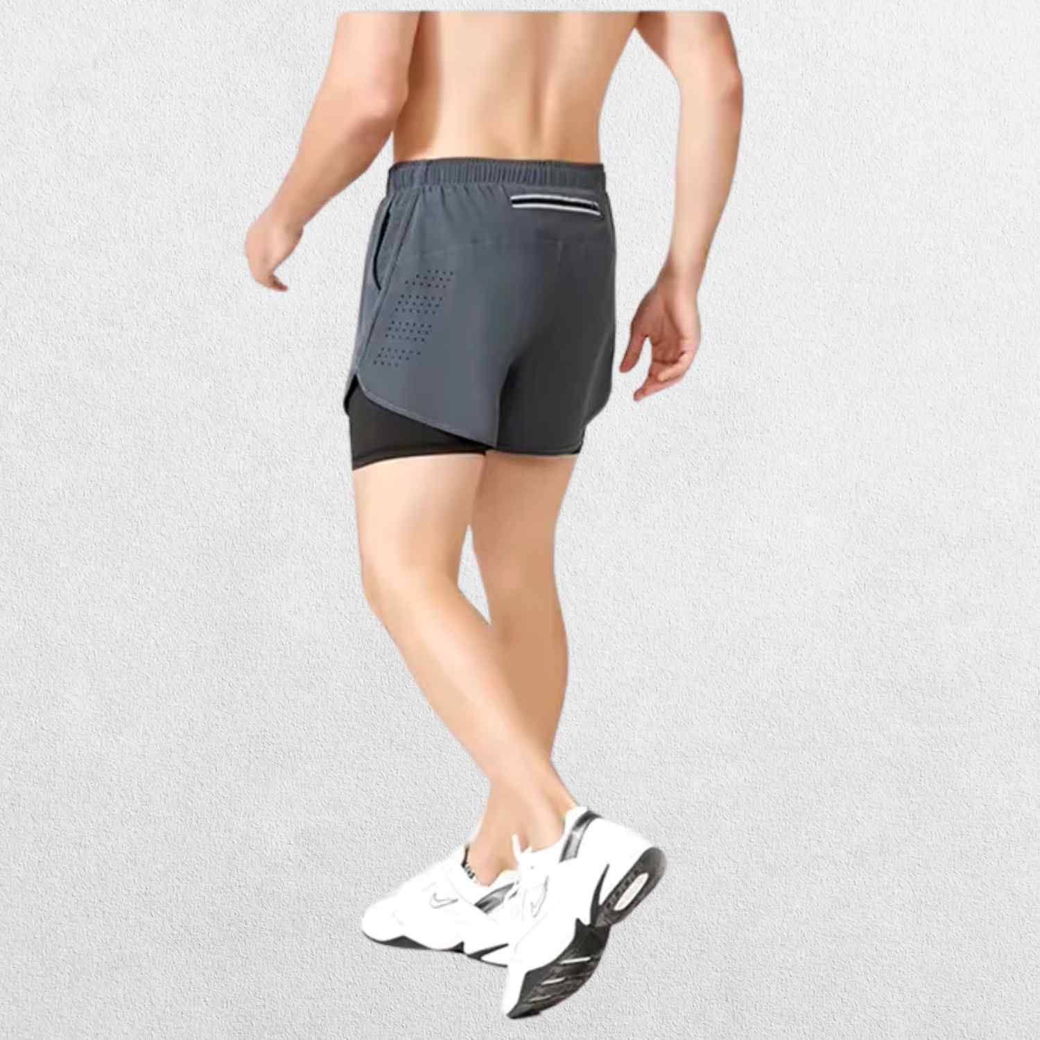 "Back view of the GPW High-Performance Men’s Running Shorts in dark grey, showing the stylish cut, rear pocket, and durable stitching against a professional studio setting."