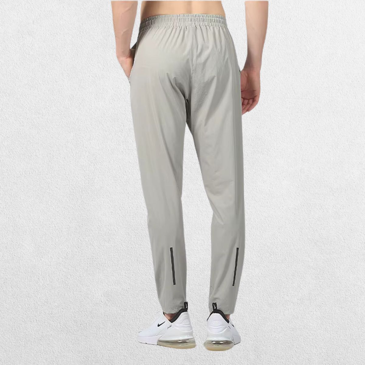 Back view of the GPW Men's Slim Fit Pencil Pants in grey, featuring the back pocket details and streamlined silhouette against a plain studio background.