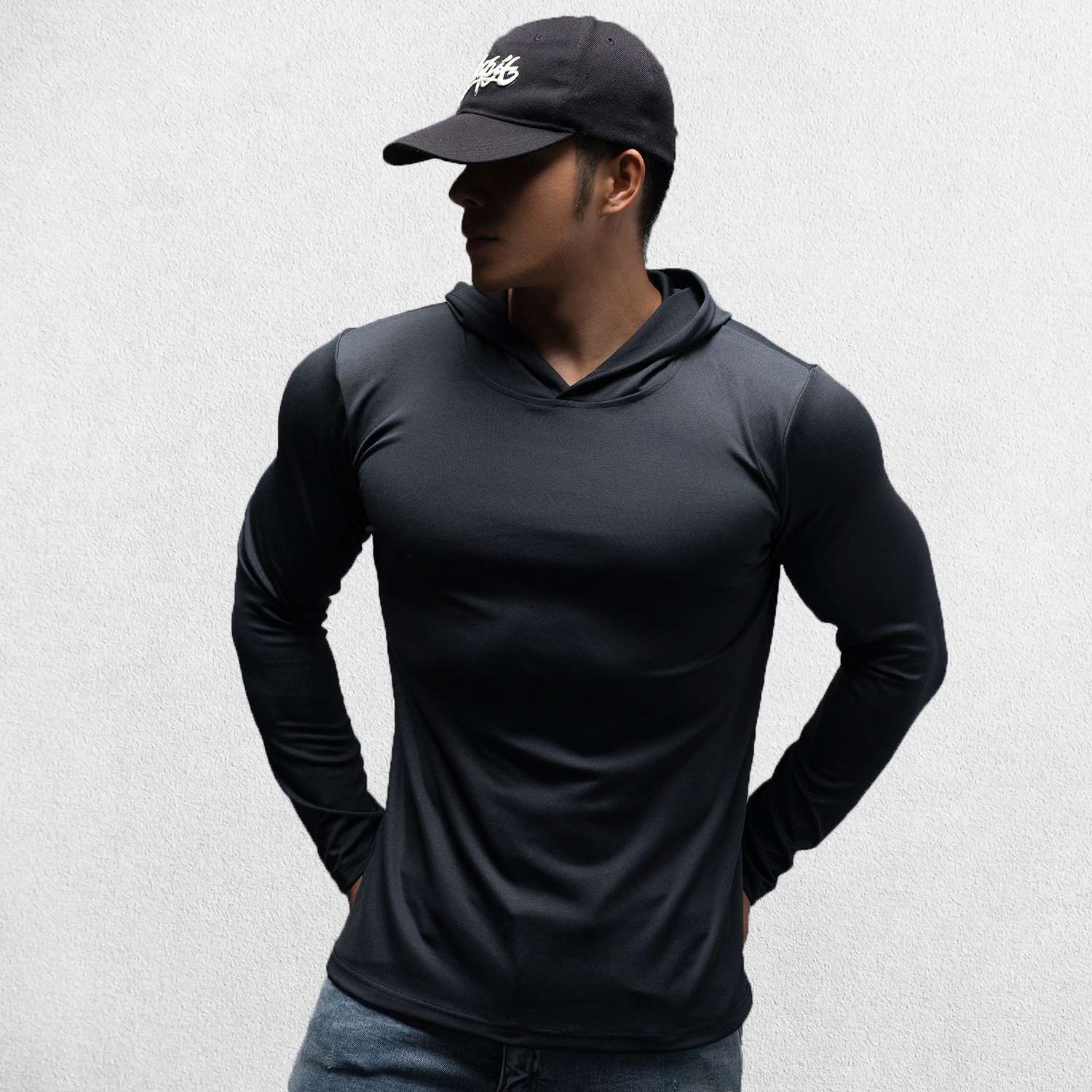 Model wearing Black Athletic Fit Fitness Hoodie Top For Running, Bodybuilding, and Fitness