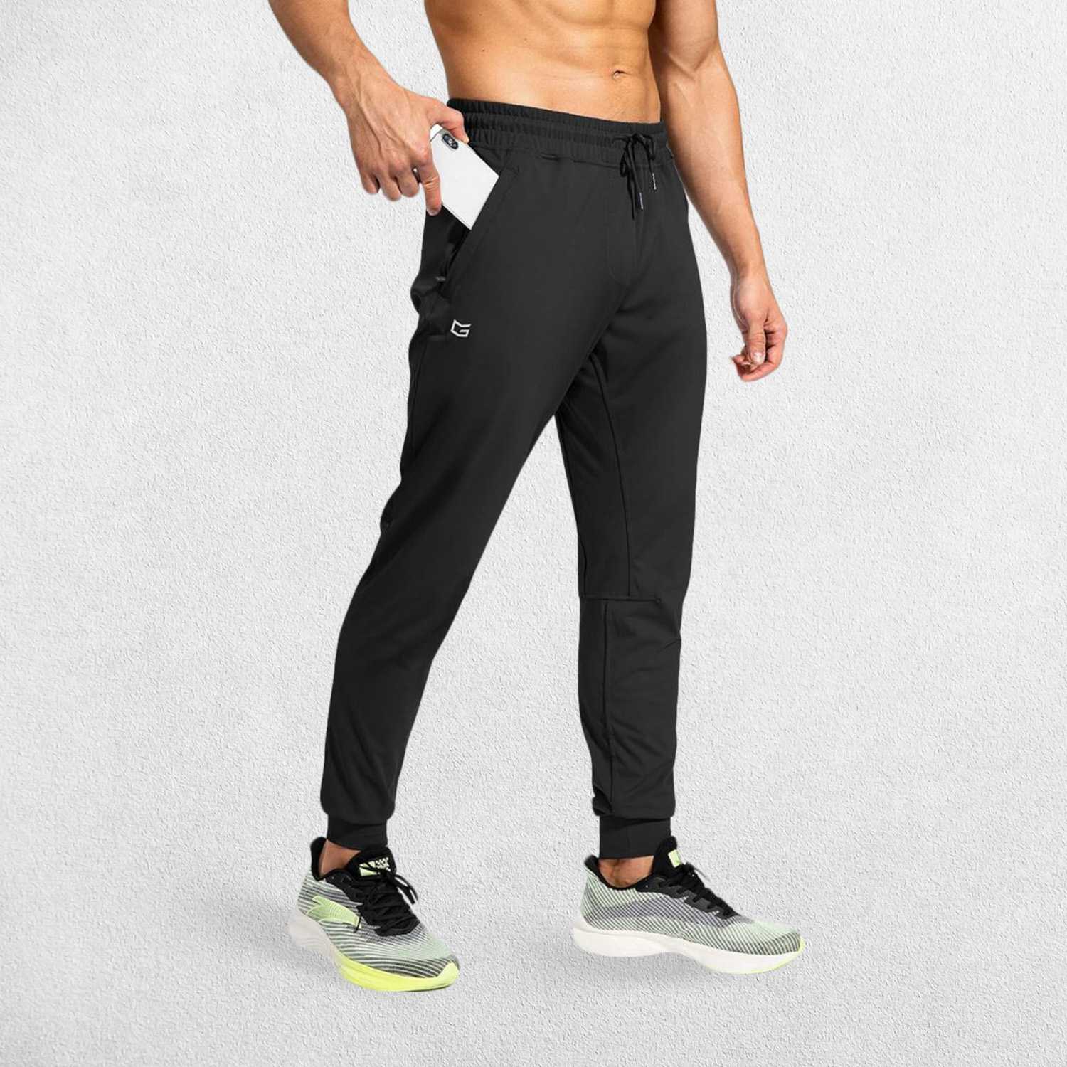 Black GPW Men's Athletic Sweatpants featuring zipper pockets, athletic fit, and sleek design.