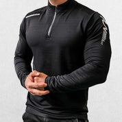 Close-up of Black GPW Men's Compression Shirt - Long Sleeve Rashguard for Fitness in a studio background