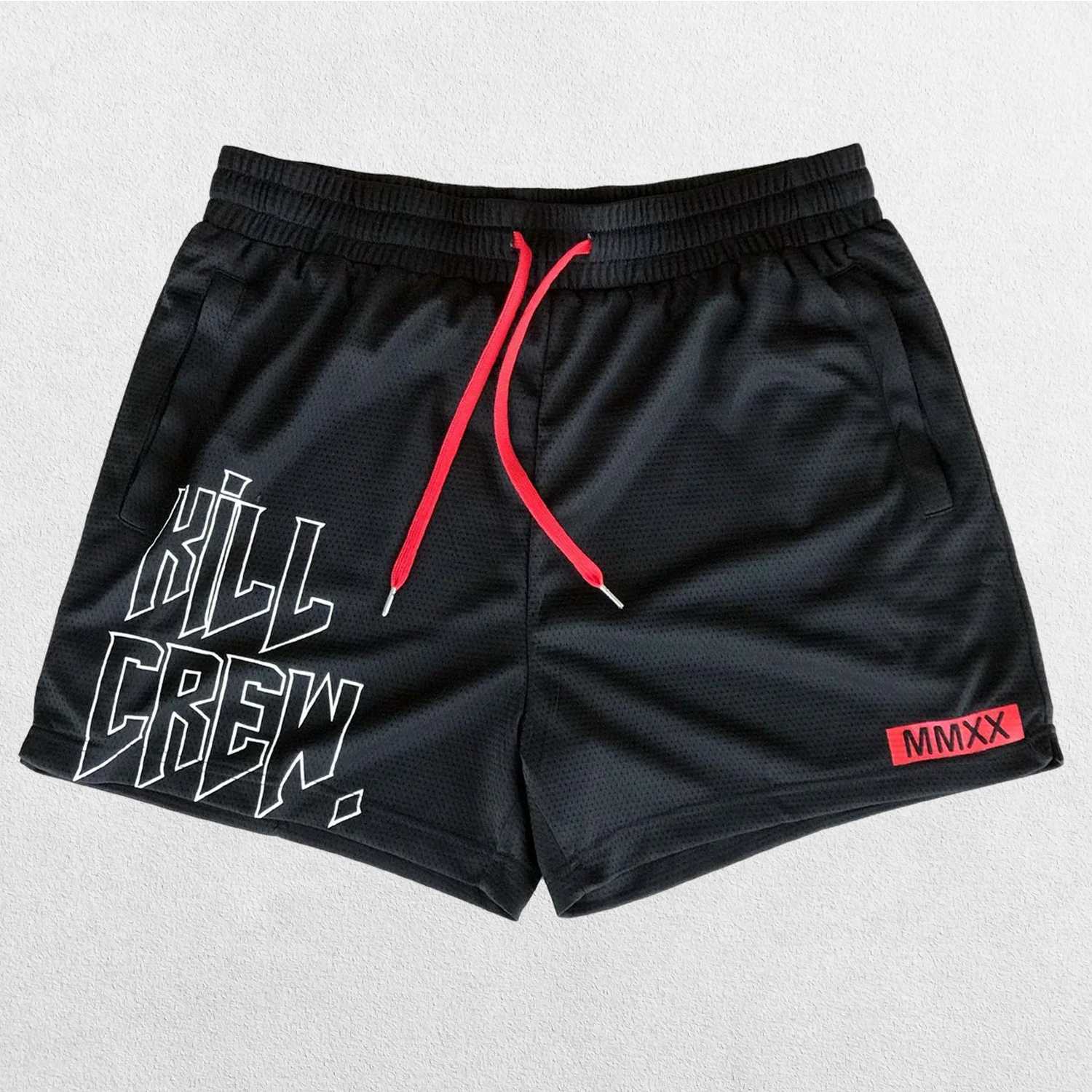 Close-up of Black bold Kill Crew graphic print on GPW gym shorts.