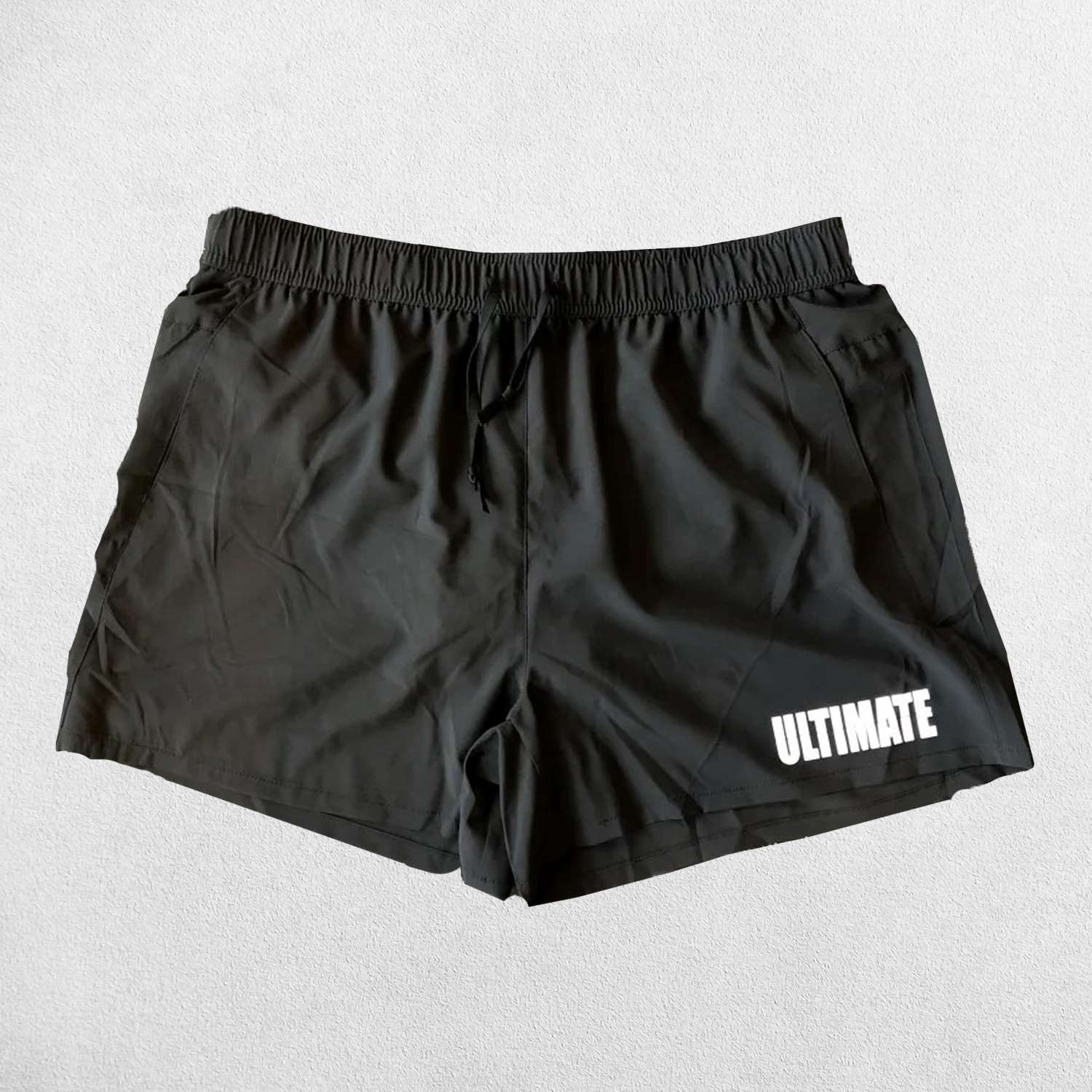 Close-up of Black GPW Men's Quick-Dry Fitness Shorts - Loose Beach Workout Bottoms