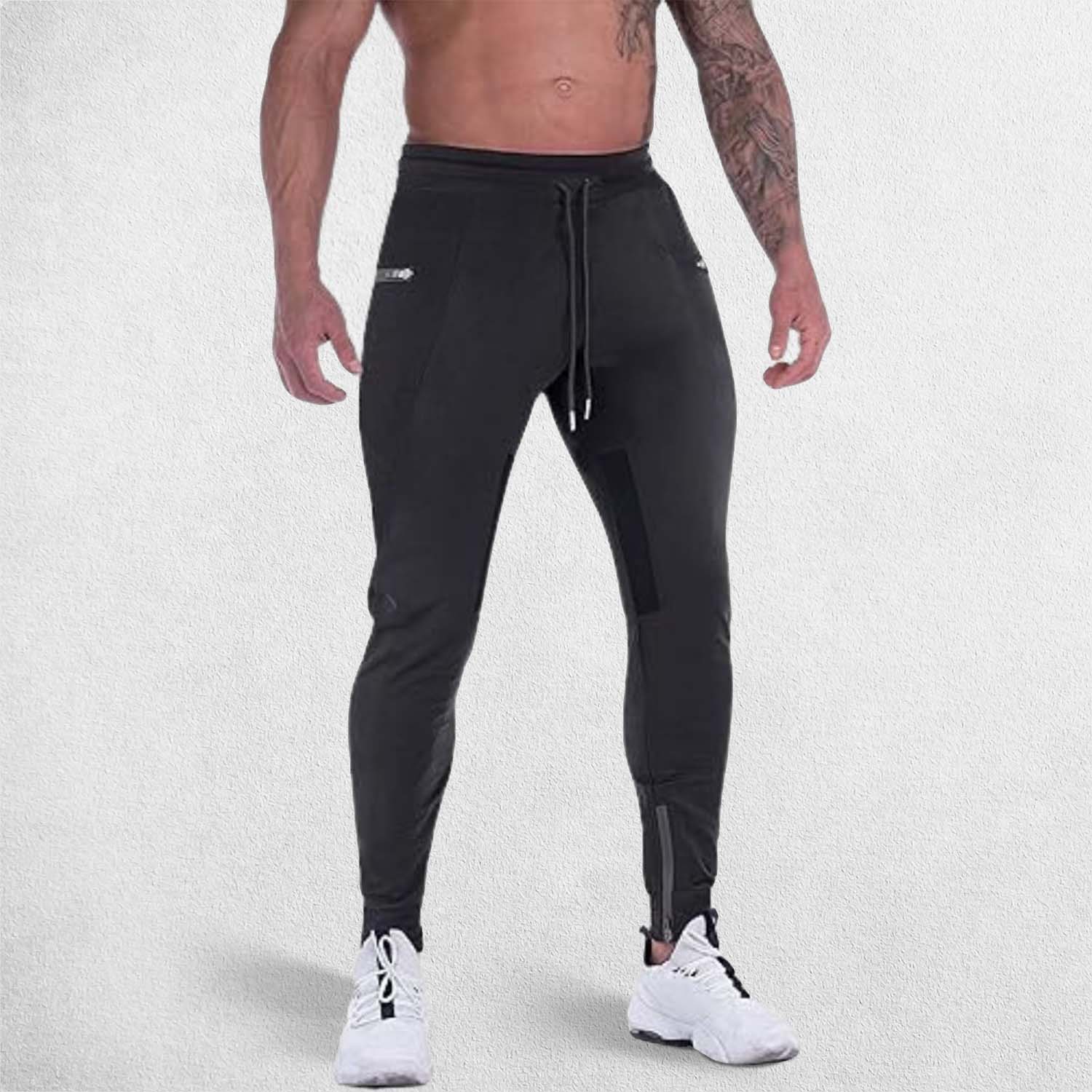 A man wearing GPW slim fit Black GPW Men's Slim Fit Trousers with Zipper Pockets for Training