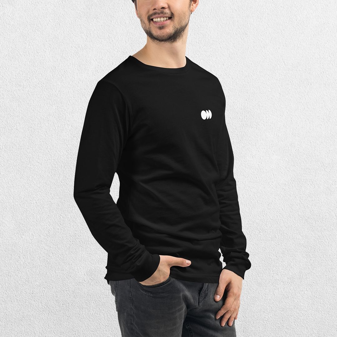 Side View of Model wearing the Black GPW Long Sleeve Tee paired with jeans in a Studio Background.