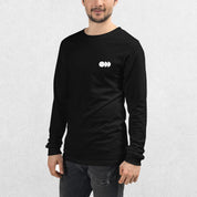 Model wearing the Black GPW Long Sleeve Tee paired with jeans in a Studio Background.