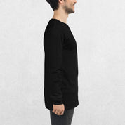 Side View of Model wearing the Black GPW Long Sleeve Tee paired with jeans in a Studio Background.
