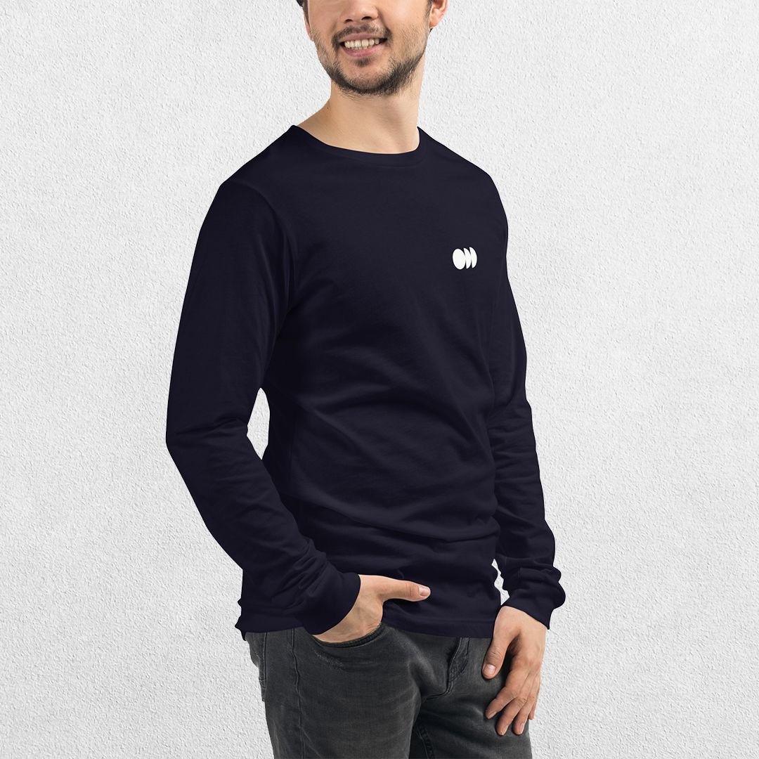 Model wearing the Black GPW Long Sleeve Tee paired with jeans in a Studio Background.