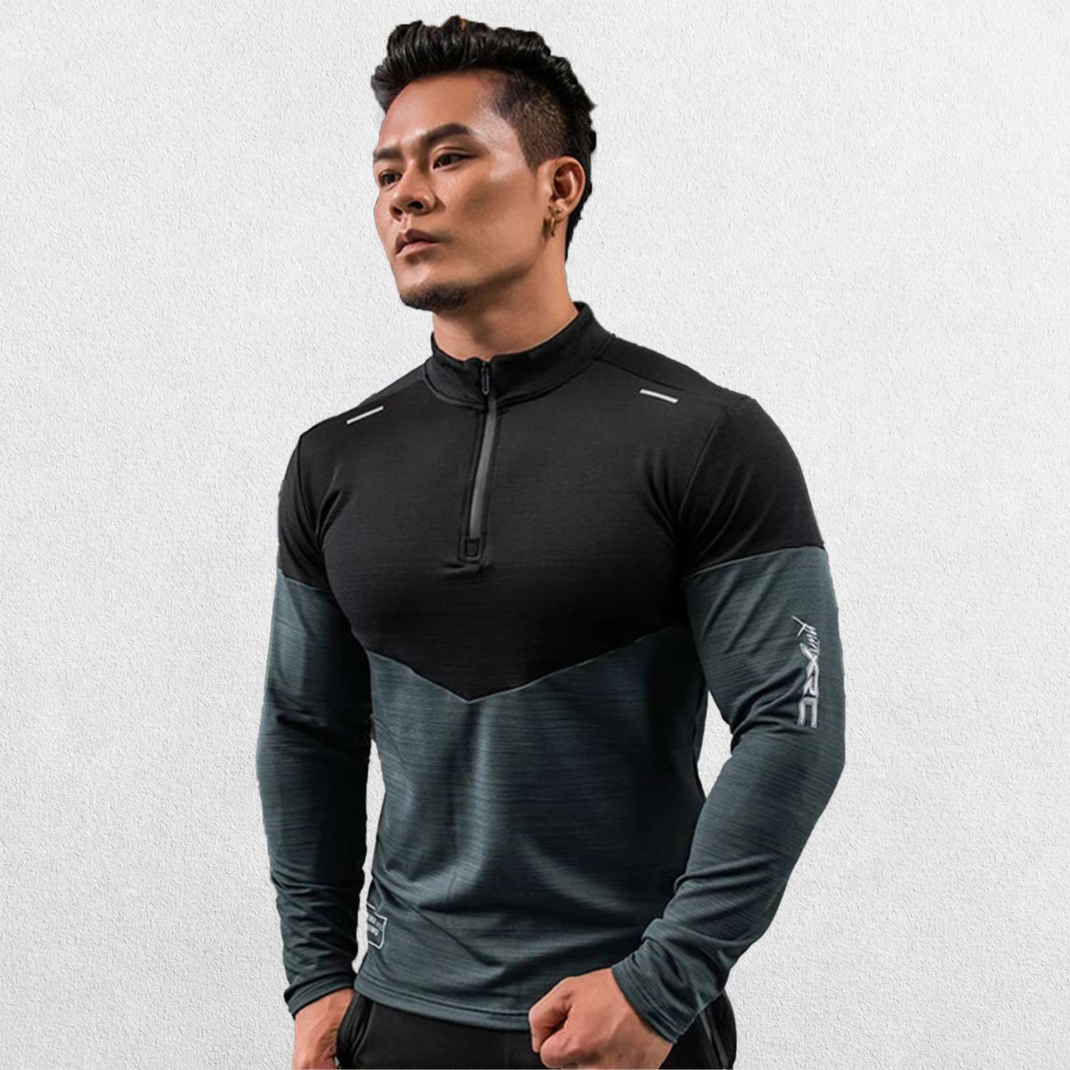 Close-up of Black Green GPW Men's Compression Shirt - Long Sleeve Rashguard for Fitness in a studio background