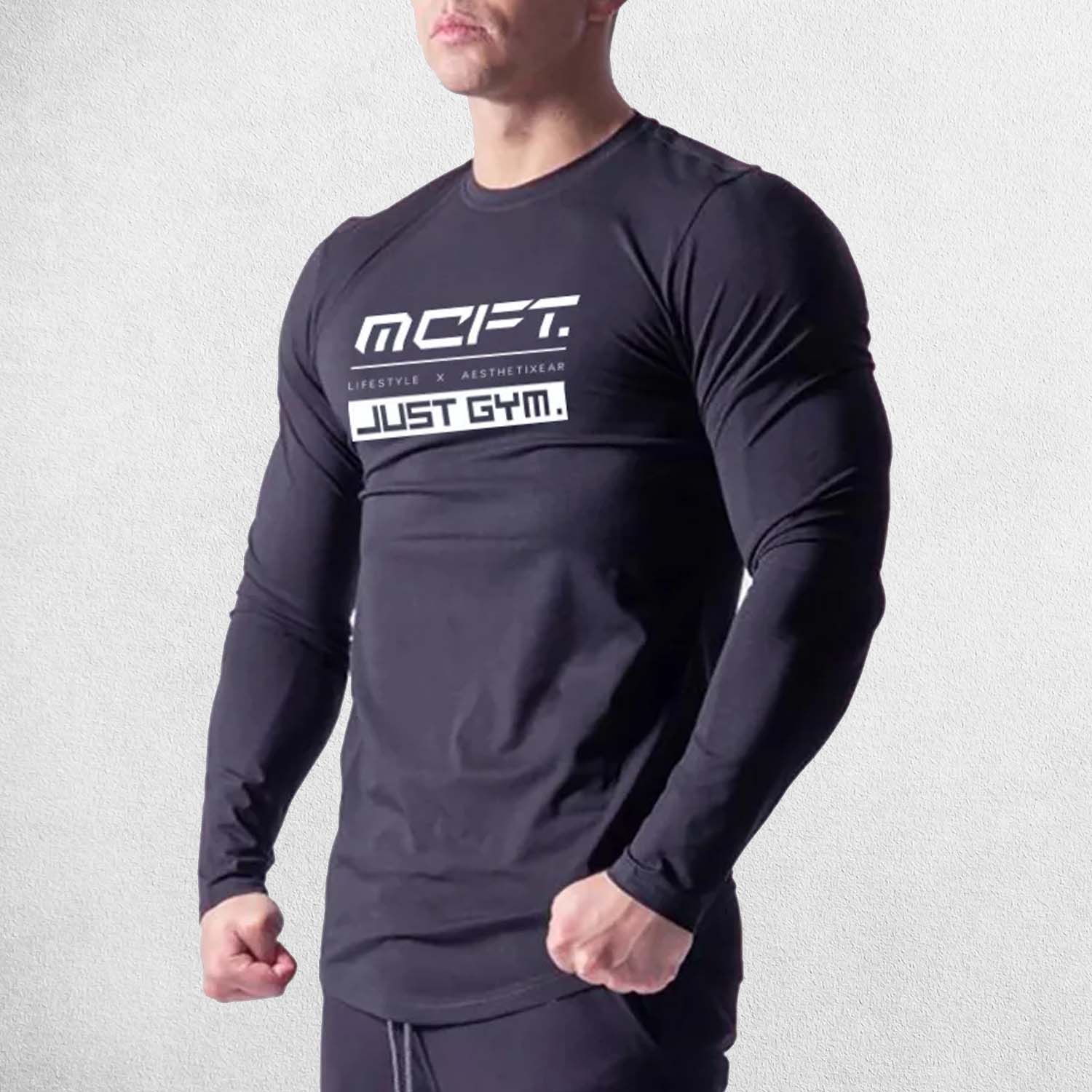 Model Wearing Black Men’s Muscle Guys Fitness Long Sleeve T-Shirt – Front view showcasing O-neck design and letter pattern for gym and casual wear.