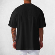 Back View of Model Wearing Black Men's Oversized Gym T-Shirt – Breathable, Quick-Drying & Lightweight Training Tee
