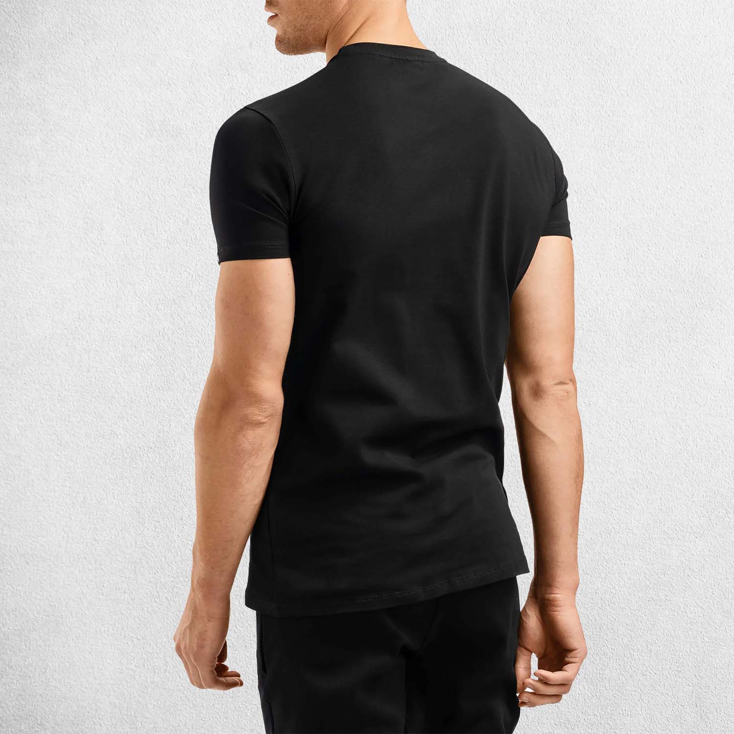 Back Pose of Model wearing Black Men’s Short Sleeve Stretch Cotton T-Shirt – Breathable, Slim Fit, Workout & Casual Wear