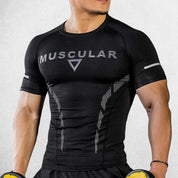 Front View Of Model Wearing Black Muscular Men’s Compression Sports T-Shirt – Quick-Dry, Slim-Fit Training & Fitness Tee for Gym, Running, and Workouts