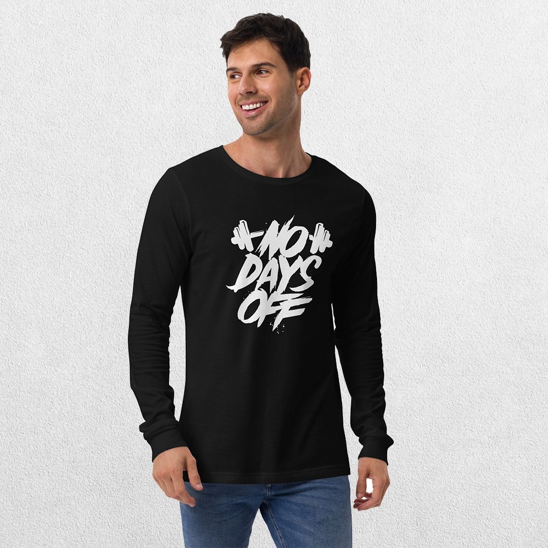 Model wearing the Black No Days Off Unisex Long Sleeve Tee - Versatile Athletic and Casual Wear with jeans in studio background.