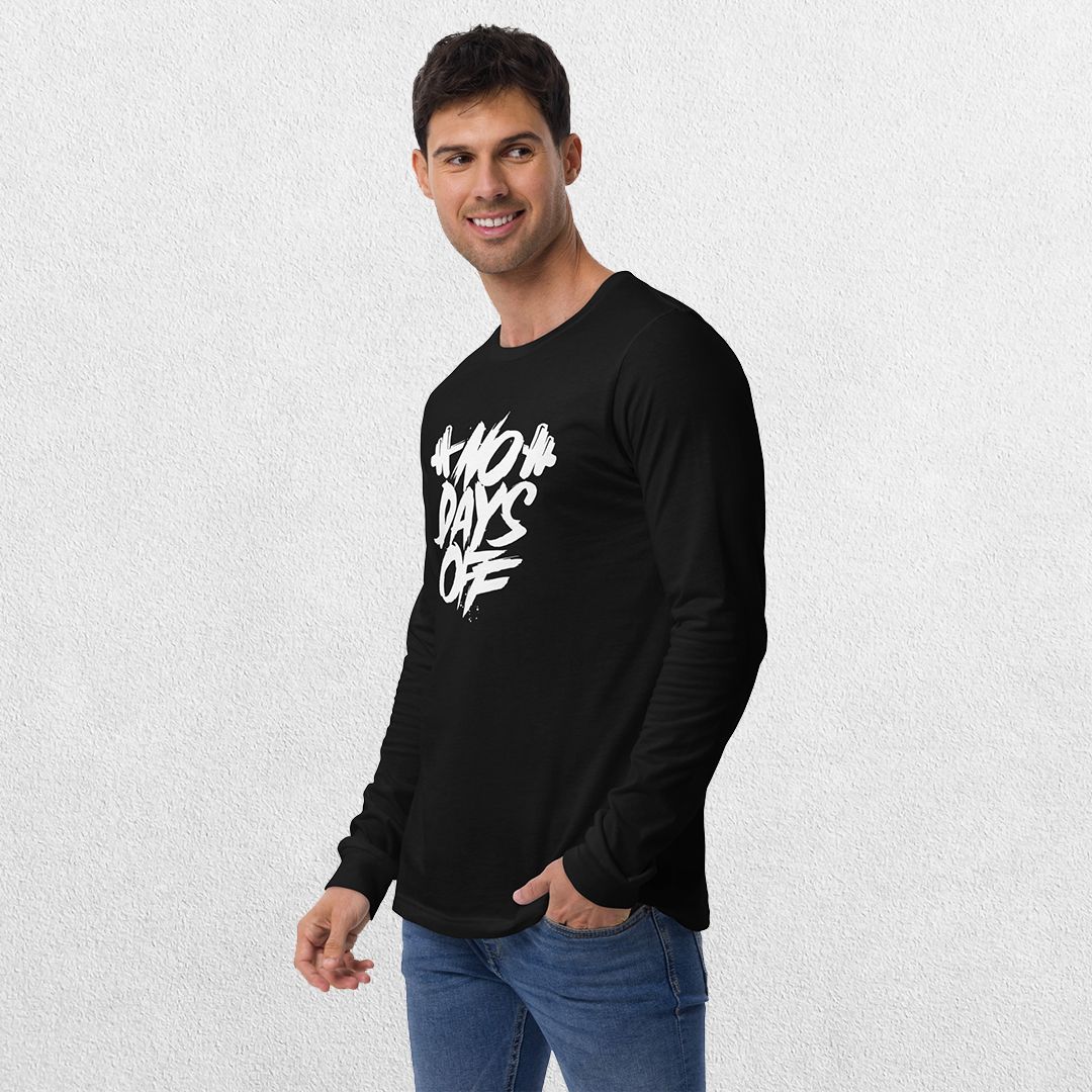 Model wearing the Black No Days Off Unisex Long Sleeve Tee - Versatile Athletic and Casual Wear with jeans in studio background.