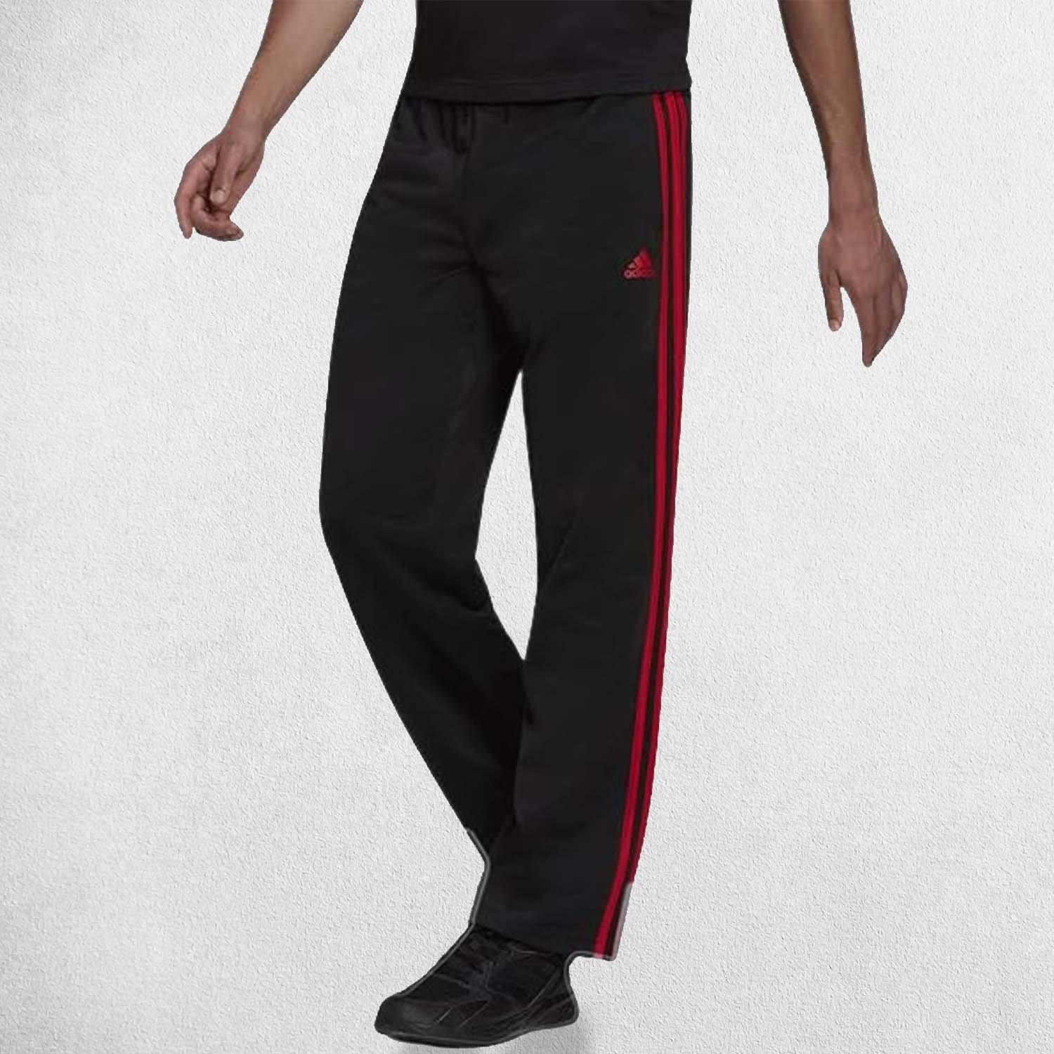 Close Up Of Model Wearing Black Scarlet Men's tracksuit pants with adjustable drawcord waistband