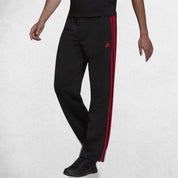 Close Up Of Model Wearing Black Scarlet Men's tracksuit pants with adjustable drawcord waistband