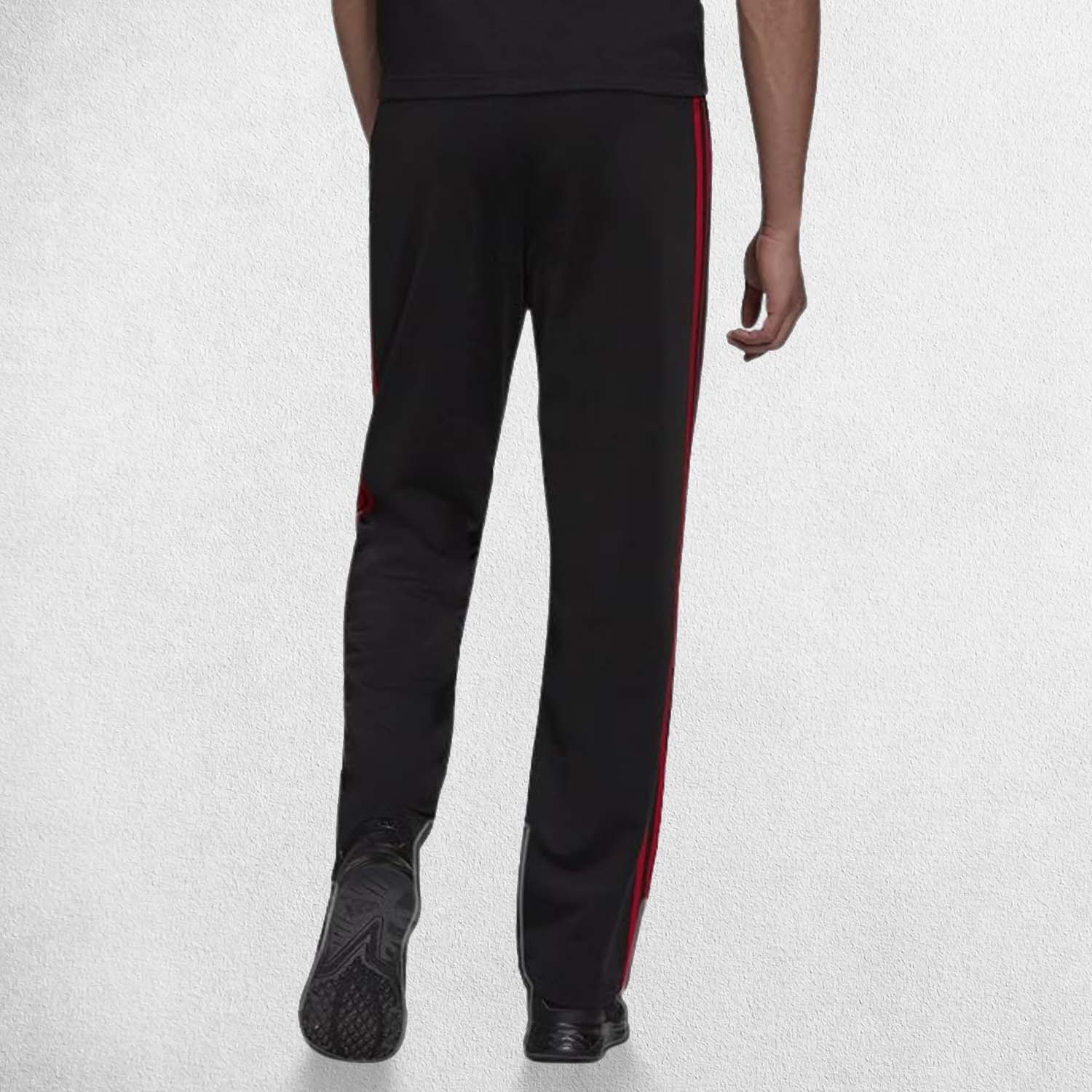 Back Pose of Model Wearing Black Scarlet 3-Stripes Tracksuit Pants made with Primegreen fabric