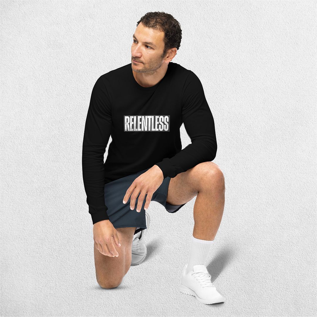 Sitting Model wearing the Athletic Heather Unbreakable Printed Unisex Long Sleeve Tee – Durable and Versatile Style