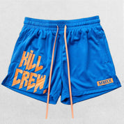 Close-up of Blue bold Kill Crew graphic print shwing its durability on GPW gym shorts.
