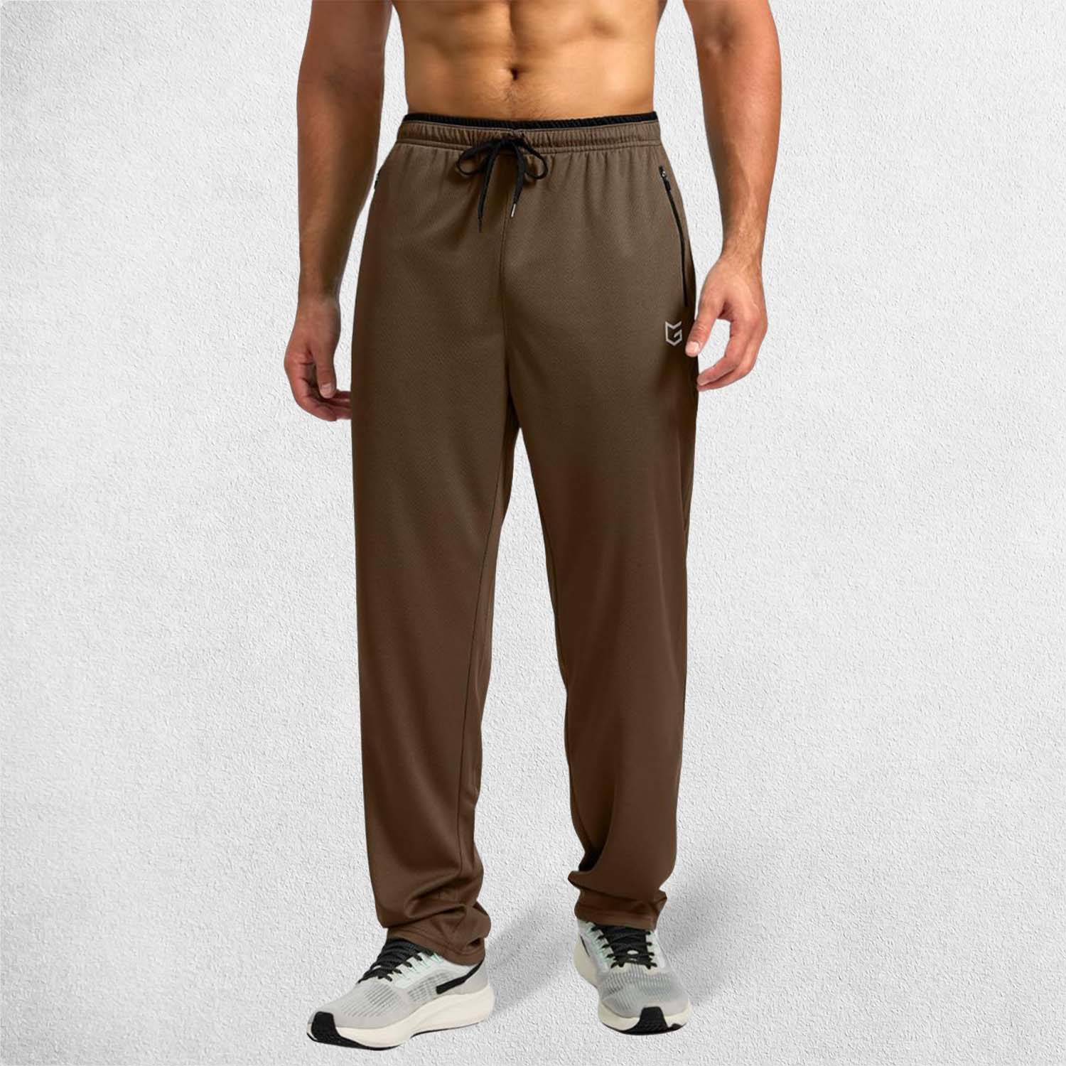 Full-length shot of Brown GPW open-bottom trousers for unrestricted movement.