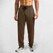 Full-length shot of Brown GPW open-bottom trousers for unrestricted movement.