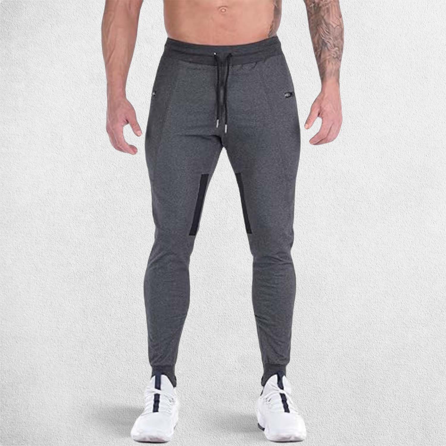 Front view of model wearing DArk Grey GPW Men's Slim Fit Trousers with Zipper Pockets for Training
