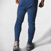 Back View of Model Wearing Dark BLue Men’s Fitness Workout Cotton Skinny Joggers for Running, Fitness & Bodybuilding