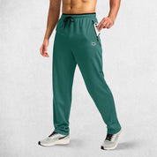 Model Showcasing Secure zippered pocket holding a smartphone on GPW Men’s athletic trousers.