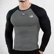 Close Up of  Model Wearing Dark Grey Black Men's Compression Quick-Dry Long Sleeve T-Shirt – Tight-Fit Gym & Running Sportswear for Training & Fitness