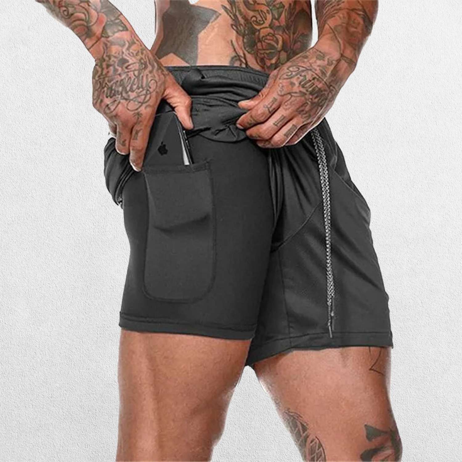 Side pose of Model Wearing Dark Grey GPW Men's 2-in-1 Running Shorts Showing pocket for mobile