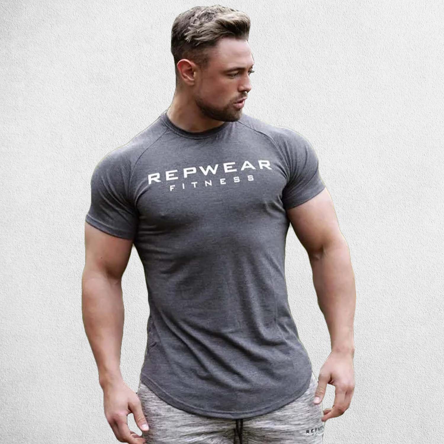 Front Pose of Model wearing Dark Grey Men’s Athletic Fit Gym T-Shirt – Breathable Cotton Workout Shirt for Training & Casual Wear
