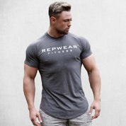 Front Pose of Model wearing Dark Grey Men’s Athletic Fit Gym T-Shirt – Breathable Cotton Workout Shirt for Training & Casual Wear