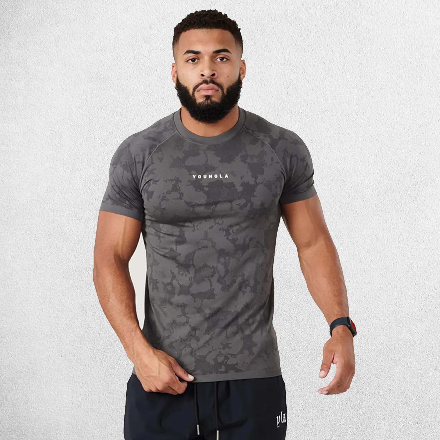 Front view showcasing raglan cut, YoungLA logo, and digital pattern for gym and sports.