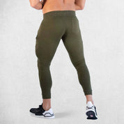 Back View of Model Walking wearing Dark Olive Green Breathable Men’s Training Joggers with elatic fibres for breathability
