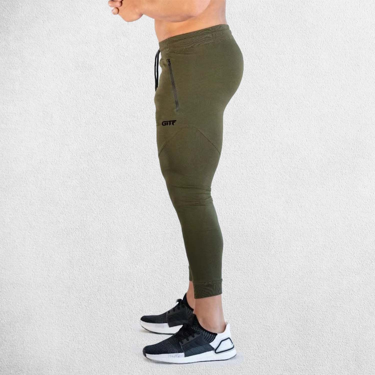 Side View Model Wearing Dark Olive Green Breathable Men’s Training Joggers with durable materials close up