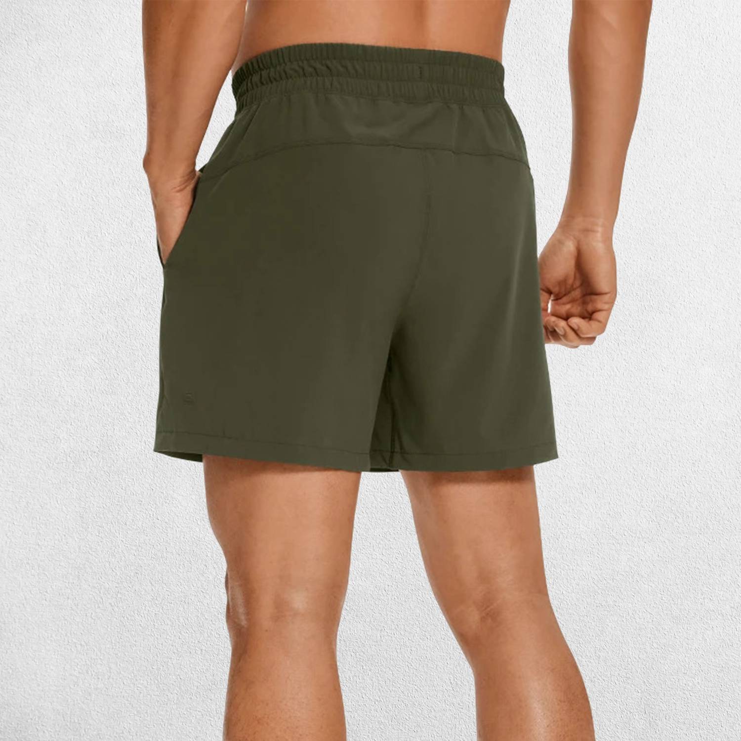 Back Close-up of Dark Olive Green GPW Men's Lightweight Quick-Dry Workout Shorts with Pockets in a studio background
