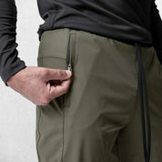 Front view of Model Wearing Dark Olive Green Men's Quick-Dry Gym Track Pants with durable zipper pocket