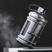 Black GPW 2L upright water bottle with Black background.