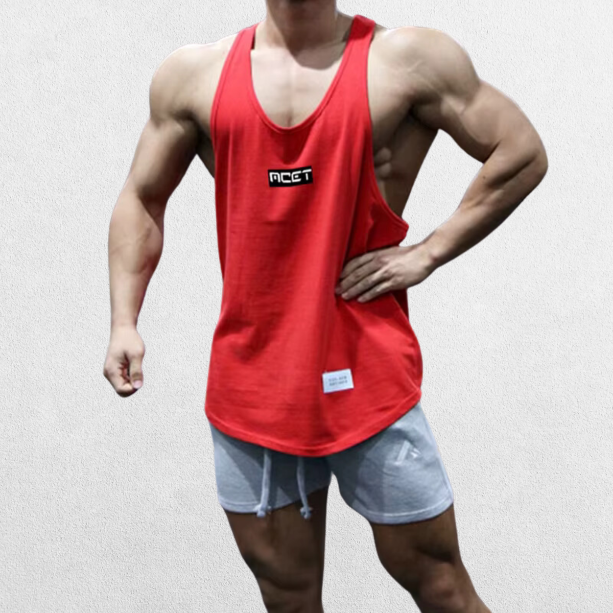 GPW Athletic Gym Tank for Men in red, front view displaying the bold color and form-fitting design against a simple studio backdrop.