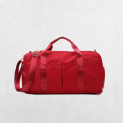 Red GPW Gym Bag with external quick-access pockets.