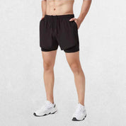 GPW High-Performance Men’s Running Shorts in black, front view highlighting the sleek athletic fit, lightweight fabric, and elastic waistband against a clean studio background."